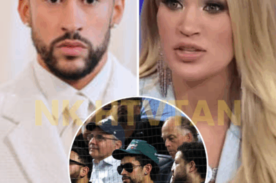 “STAND UP OR GET OUT.” — CARRIE UNDERWOOD JUST WENT OFF ON BAD BUNNY, AND THE INTERNET IS MELTING DOWN 🇺🇸🔥 Bad Bunny’s decision to remain seated during “God Bless America” sparked whispers — until Carrie Underwood turned them into headlines. Her no-nonsense response? “If he doesn’t like America, then leave.” The crowd roared. Social media exploded. And suddenly, a moment at a baseball game became ground zero for a national debate on patriotism, protest, and public platforms. Is this a simple call for respect — or a culture clash boiling over? 👇 The full exchange, the fan reactions, and why this may be Carrie’s boldest stand yet.