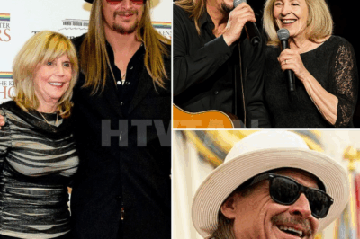 “Well, look who just hijacked my show!” — Kid Rock’s MOM Stormed the Stage… and What Happened Next Stopped the Crowd Cold. 💔🎶  Nobody saw it coming. No spotlight. No cue. Just one unforgettable moment.  In the middle of a full-throttle, stadium-shaking concert, Kid Rock’s mother, Susan Ritchie, walked onto the stage — unannounced. The crowd blinked. Then screamed.  “Couldn’t let you have all the fun, son!” she grinned. He laughed, then stepped aside — and handed her the mic.  What followed wasn’t fire. It was soul.  Together, mother and son launched into an unrehearsed ballad from his early Detroit years — a song soaked in memory, raw love, and something deeper than fame.  Her voice: soft and steady. His: gravel and grace. Together: pure magic.  Phones dropped. Hands rose. Goosebumps. Everywhere.  One song. No rehearsal. No ego. Just family, music… and a love that’s louder than any anthem.  👇 Full video + behind-the-scenes story of the moment that reminded everyone: