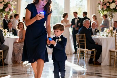 At my sister’s wedding, my seven-year-old suddenly squeezed my hand and whispered, “Mom… we need to leave. Right now.” I bent down with a gentle smile. “Why, honey?” He glanced around, then slowly took a phone out of his pocket. His voice shook—quiet but unmistakably clear: “Mom, watch this…” The screen lit up. And the instant I saw the video, I went completely still, my heart clenching as if someone had reached in and crushed it…